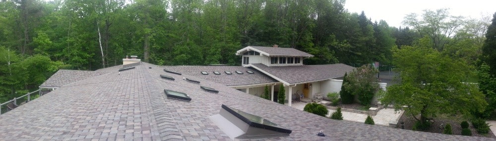 Large roofing company installs asphalt shingles in Milwaukee