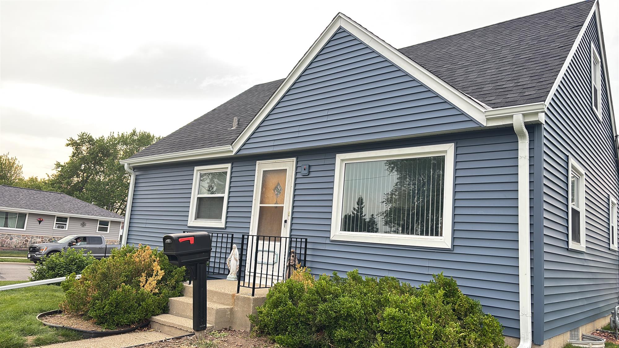 Modern home with newly installed energy-efficient windows and updated siding