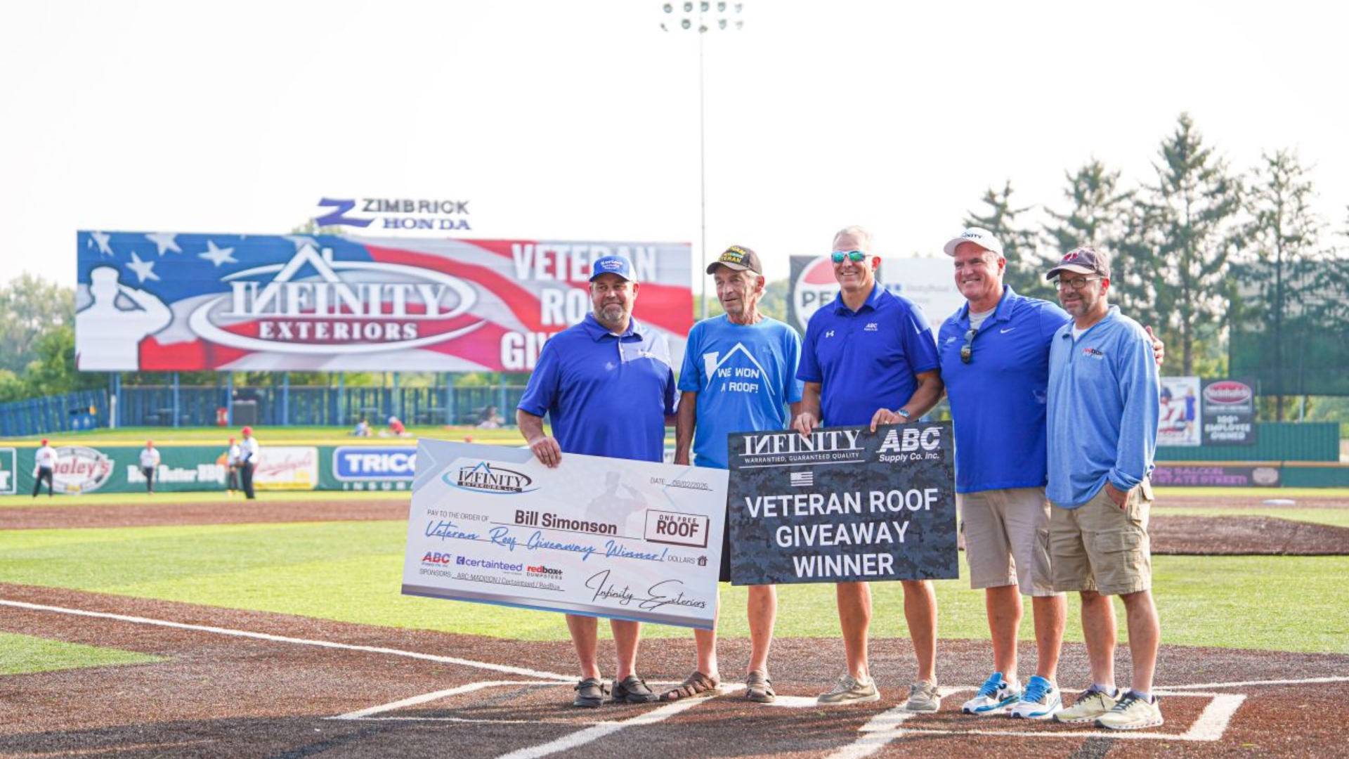 Infinity Exteriors honors Vietnam veteran Bill with a free roof giveaway at the Madison Mallards game.