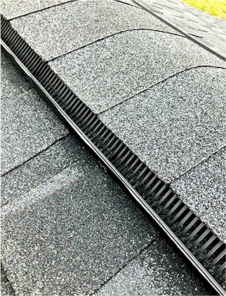 checking attic ventilation during a roof inspection in deerfield