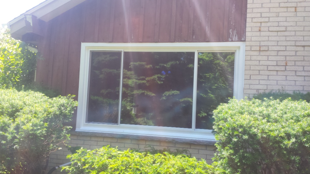 Sliding vinyl window replacement by Wisconsin contractors